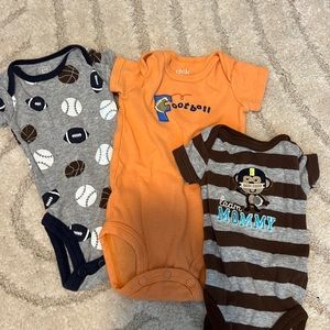 Sports themed newborn onesies